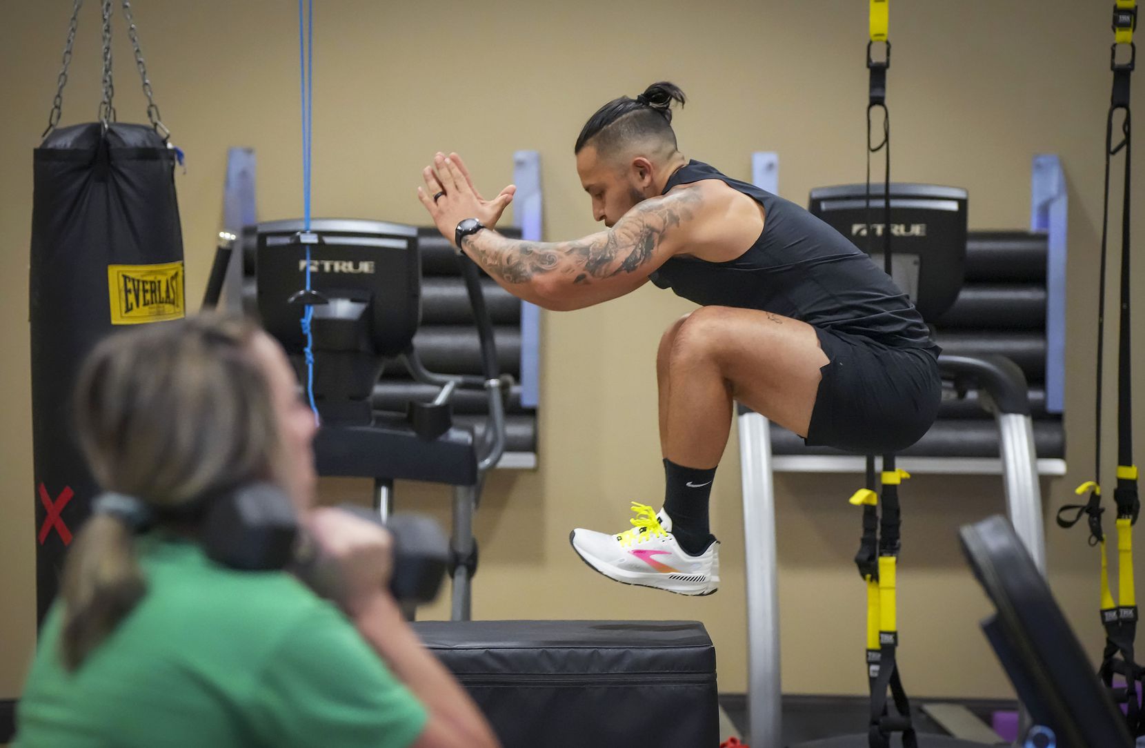Marcial Marichalar III uses a jump box while working out in the gym at Hill & Wilkinson...