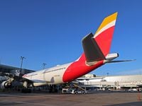 An Iberia Airbus A330-200 parked at DFW International Airport's Terminal D for the airline's...