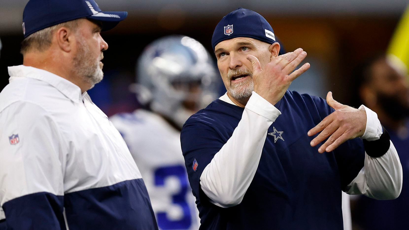 Dallas Cowboys head coach Mike McCarthy (left) listens to his defensive coordinator Dan...