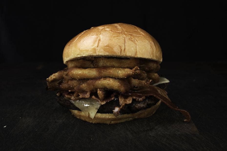 The barbecue bacon burger at AT&T Stadium is a 10-ounce beef patty topped with pepper jack...