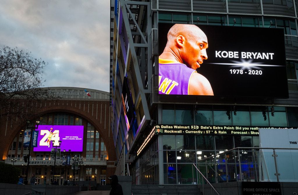 Large screens display a tribute to former Los Angeles Laker Kobe Bryant and his daughter,...