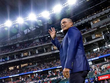 Texas Rangers Baseball Hall of Fame member Ivan 'Pudge' Rodriguez waves to the crowd as he's...