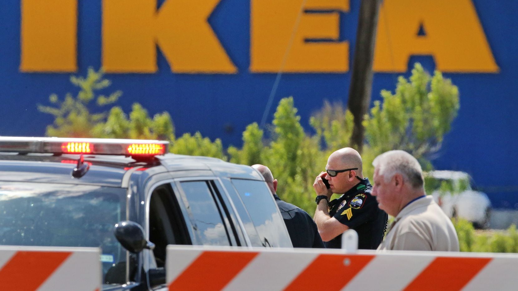 Grand Prairie police officers at the scene of a confrontation with an armed man outside the...