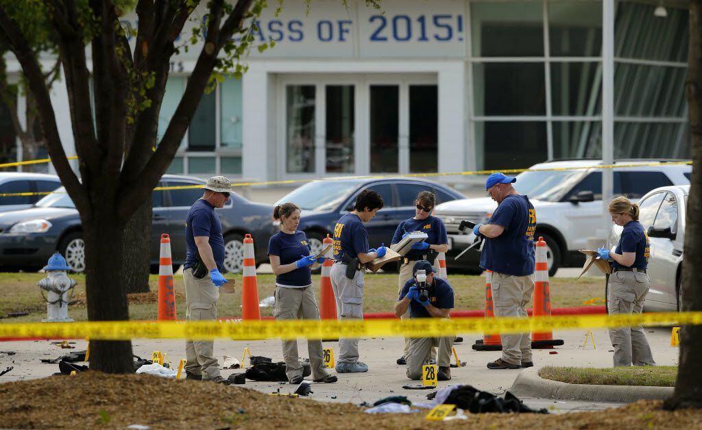 FBI personnel document the crime scene on May 4, 2015, outside Curtis Culwell Center in...