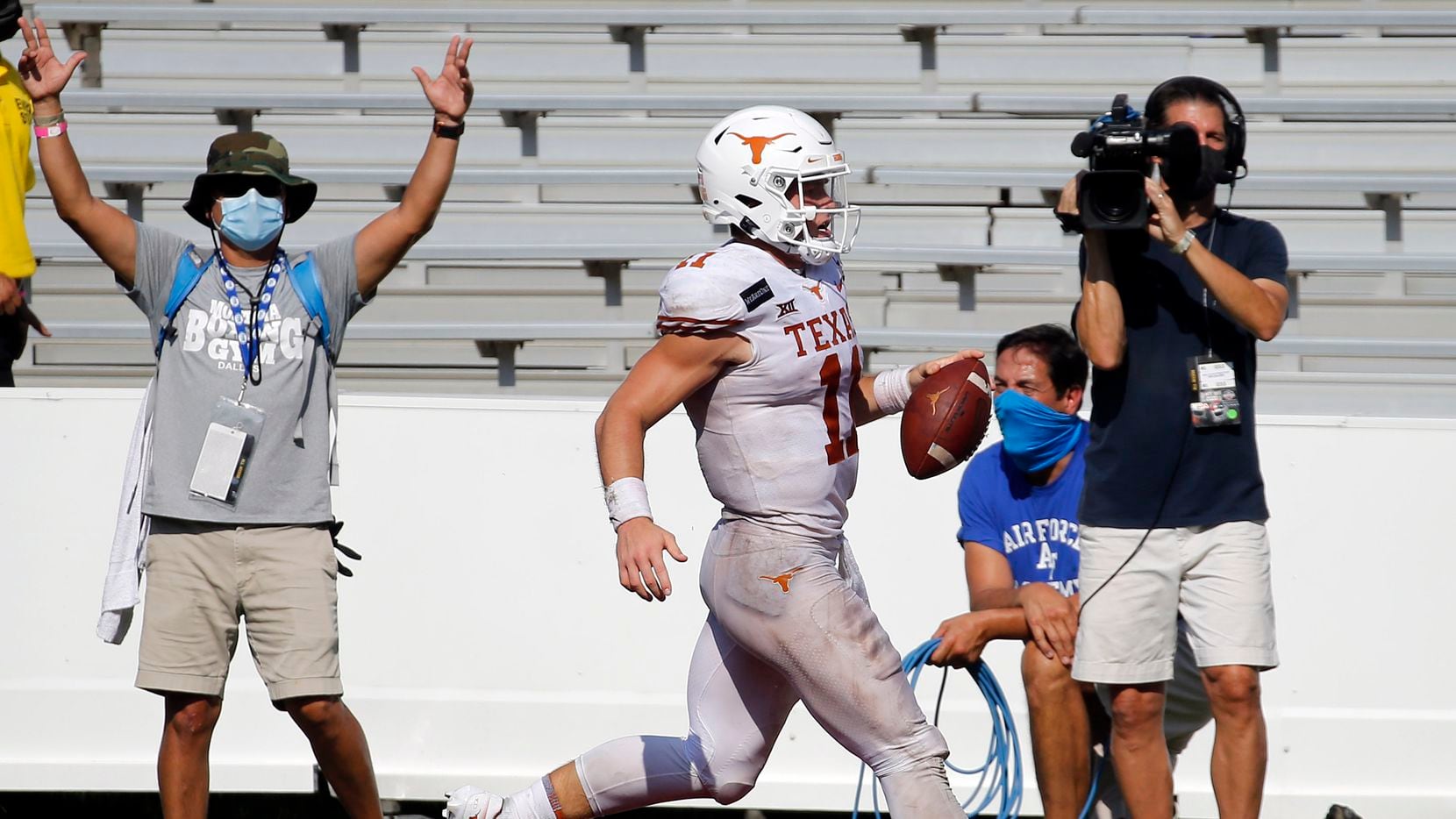 Texas quarterback Sam Ehlinger (11) scores a touchdown during the second overtime against Oklahoma in the Red River Showdown at the Cotton Bowl in Dallas on Saturday, Oct. 10, 2020.