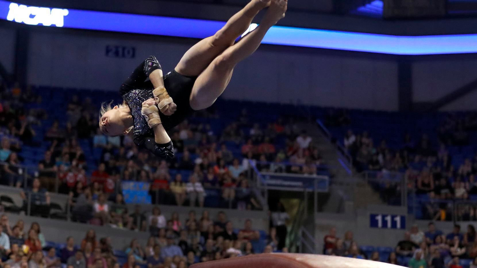 FILE - UCLA's Madison Kocian competes on the vault during the NCAA college women's...