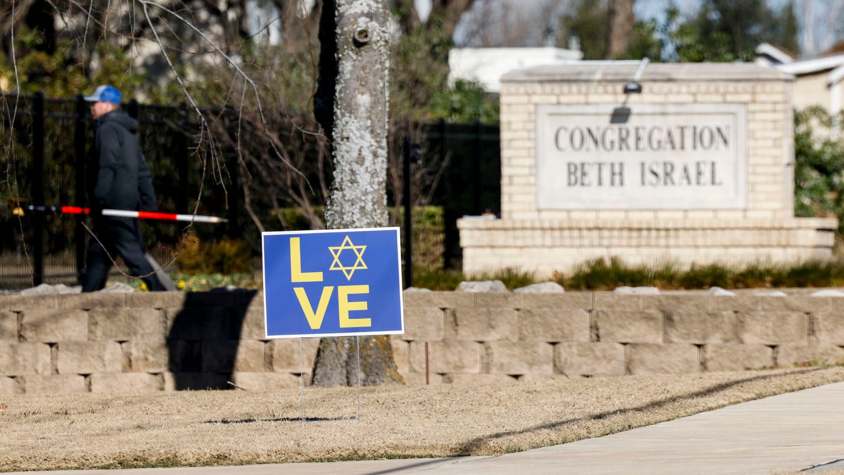 A sign outside of Congregation Beth Israel synagogue on the day after an 11-hour standoff in...