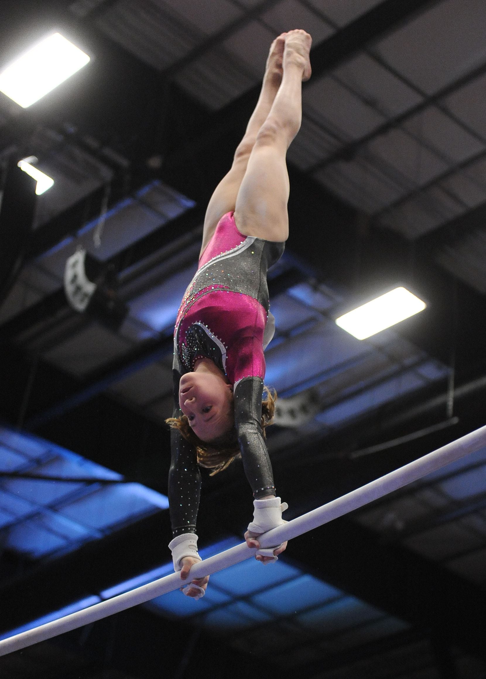 WOGA gymnast Madison Kocian competes on the bars during the competition. Gymnasts from Texas...