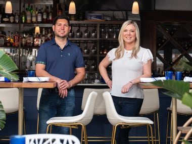 Co-owners Chris Kostas and Amanda Kostas of Greek Isles Grille & Taverna in Dallas, in the patio area of their restaurant, on Friday, Dec. 10, 2021.