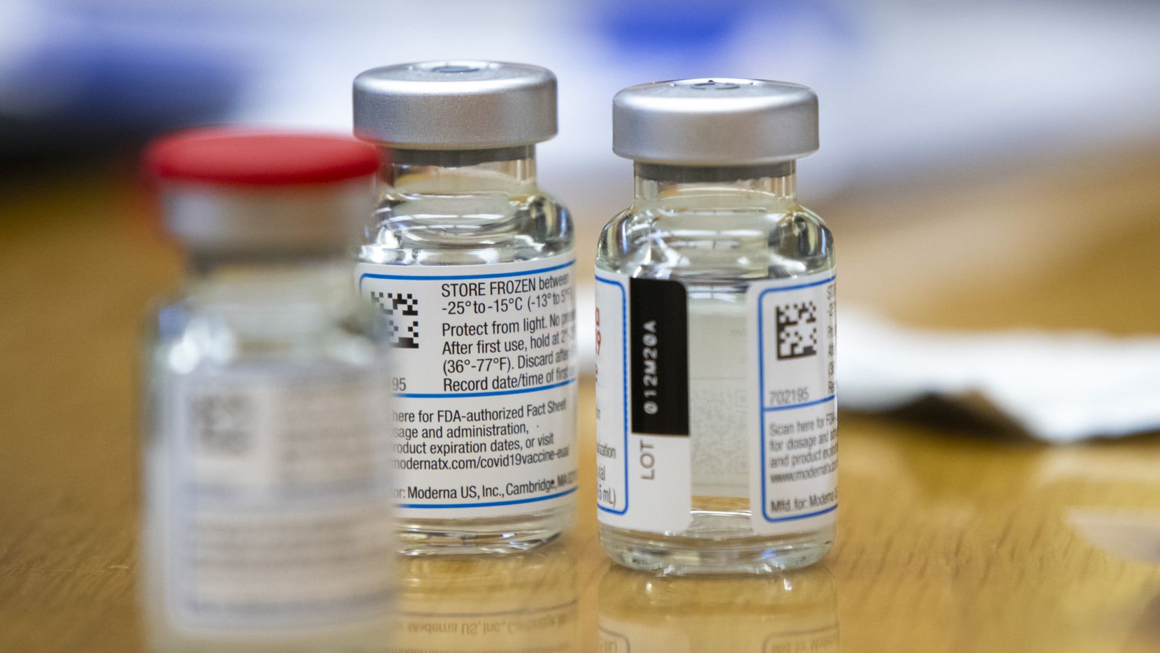 A trio of vials containing the Moderna COVID-19 vaccine at the Corpus Christi Fire...