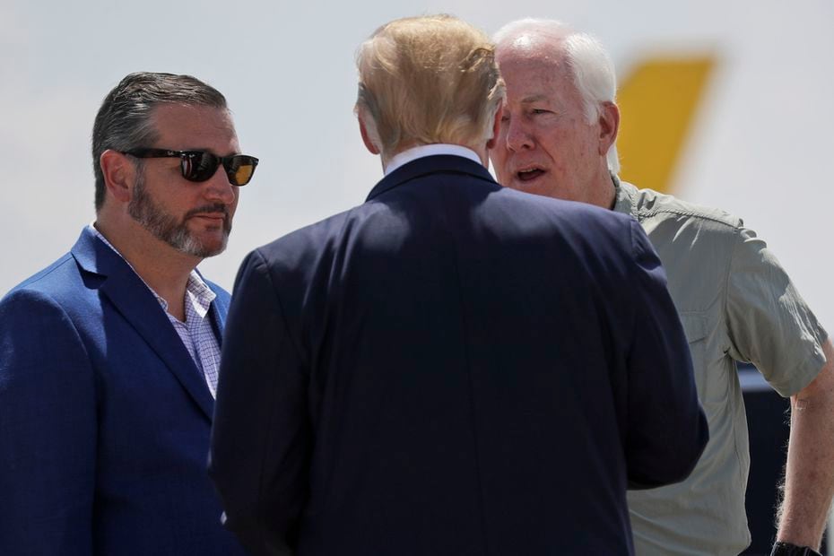 President Donald Trump talks with Sens. John Cornyn and Ted Cruz as he arrives at El Paso International Airport on Aug. 7, 2019, four days after a mass shooting at a local Walmart that left 22 people dead.