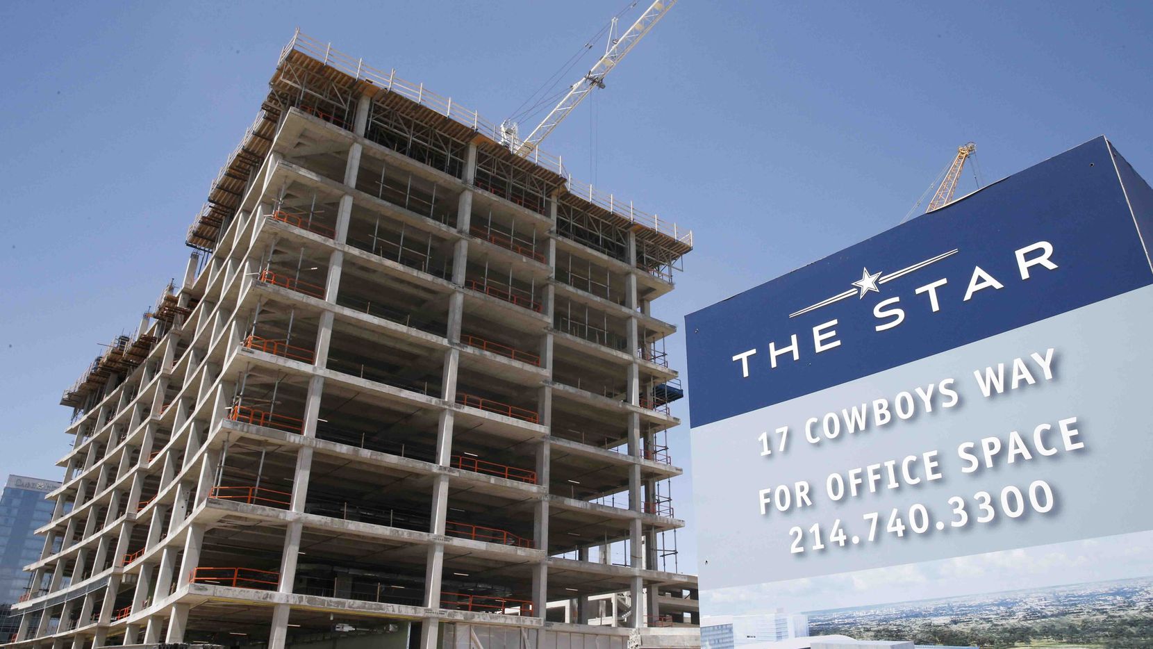 An 11-story office tower is under construction on the Dallas North Tollway that is the next...