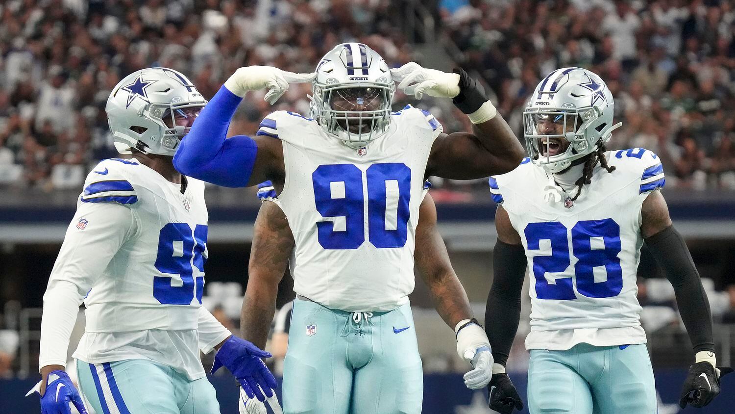 Dallas Cowboys defensive end DeMarcus Lawrence (90) celebrates after a defensive stop during...