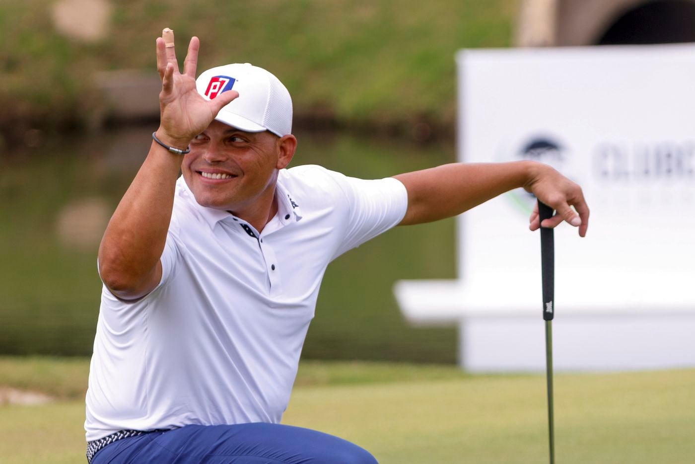 MLB Hall of Fame catcher Ivan "Pudge" Rodriguez waves to fans on the 17th green during the...