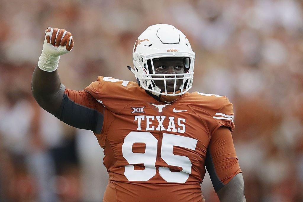 AUSTIN, TX - SEPTEMBER 04: Poona Ford #95 of the Texas Longhorns reacts during the first...