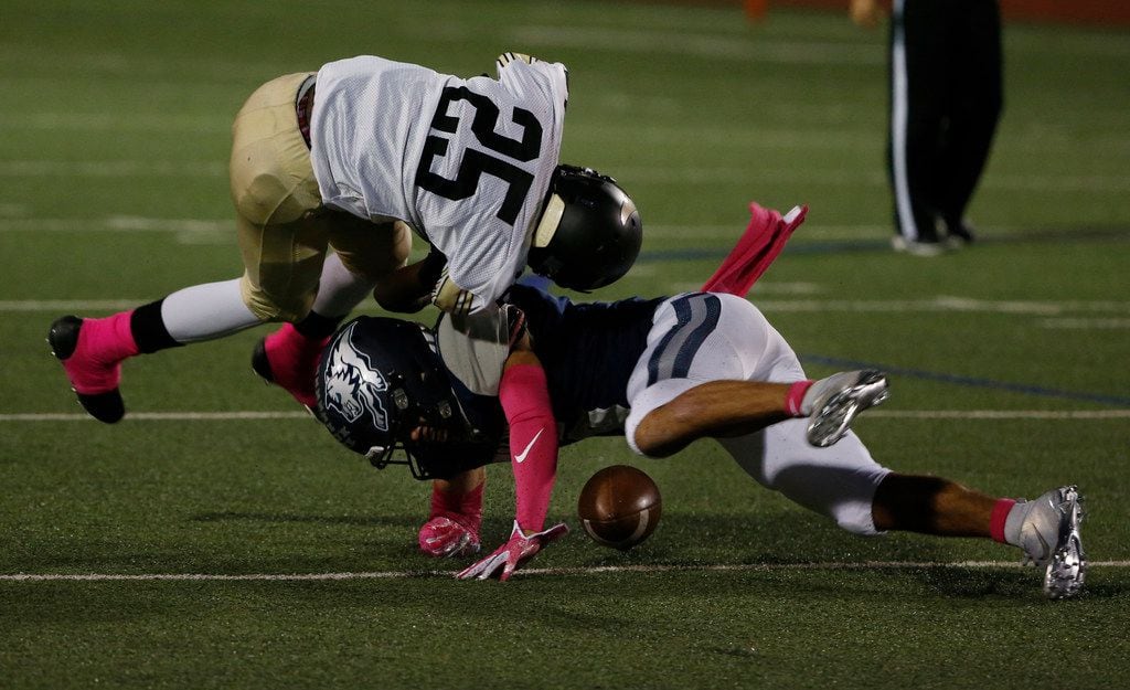 Pinkston's Michael Sloan (25) is upended by Ranchview's Dorian Windley (6) during the first...
