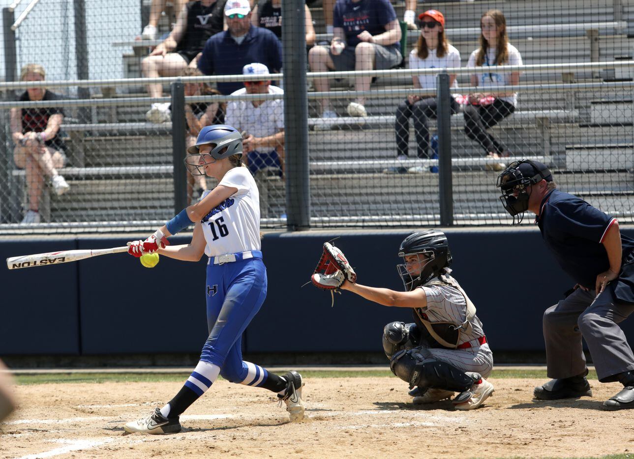 Hebron High School player #16, Ashley Vaccaro, swings and misses during a softball playoff...