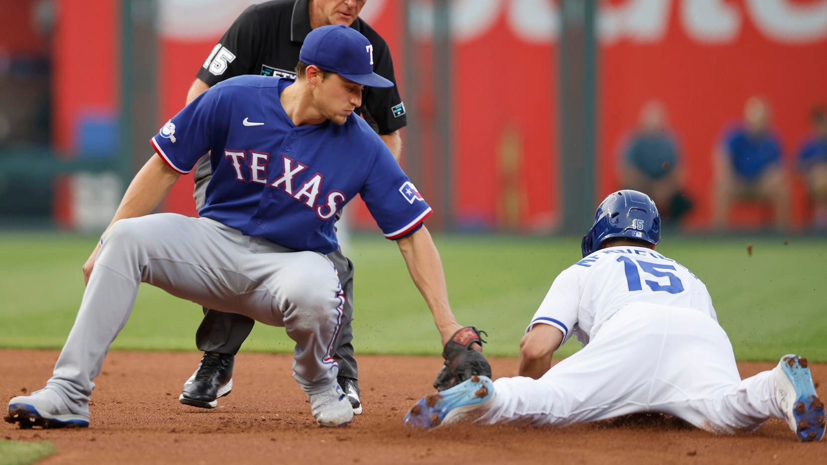 Texas Rangers shortstop Corey Seager, left, is late with the tag as Kansas City Royals' Whit...