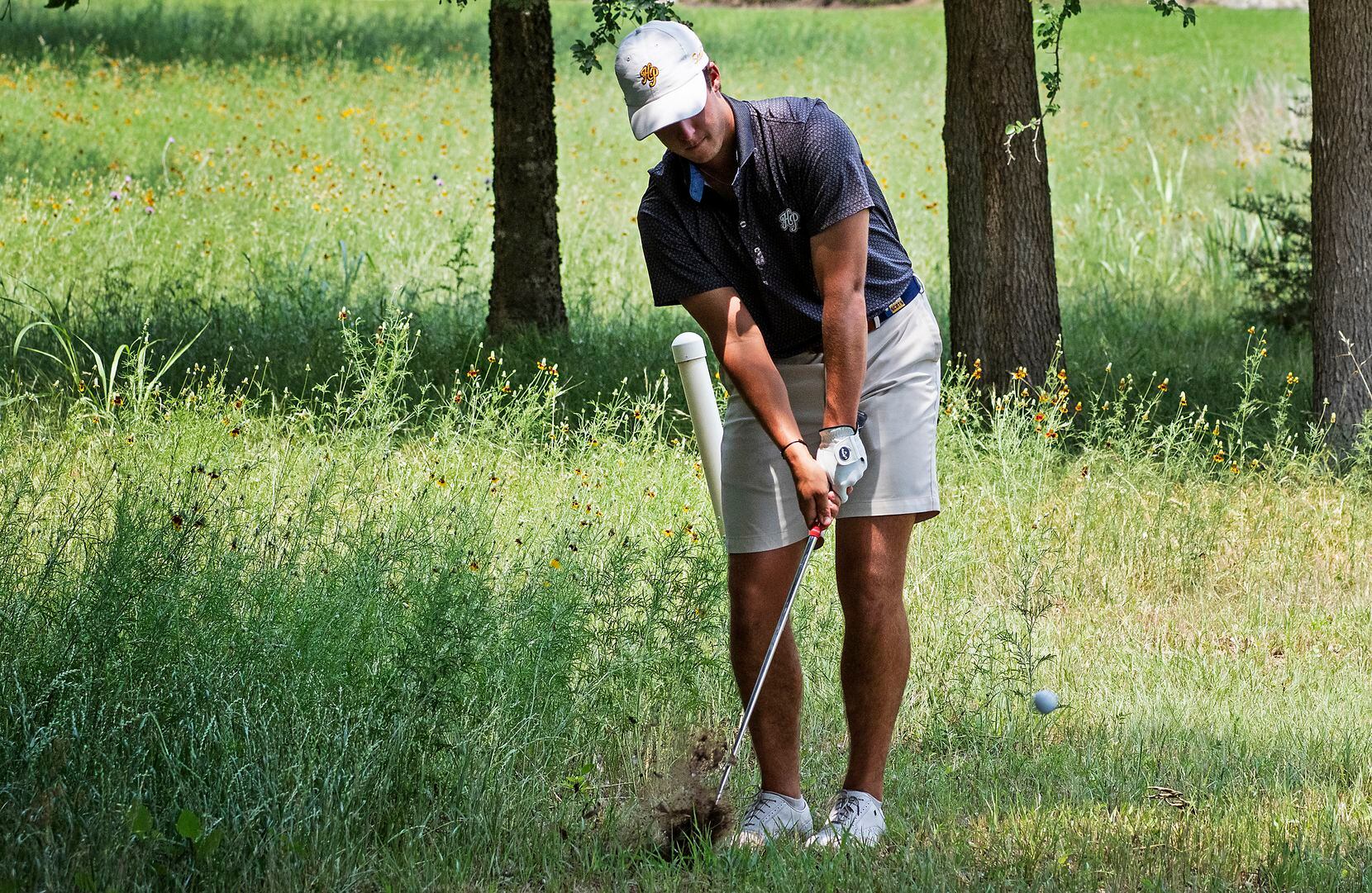 Highland Park, Joe Stover, chips out of the rough on the no. 14 hole during the first round...