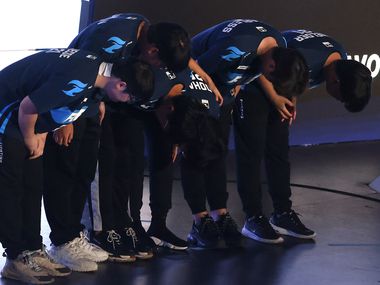The Dallas Fuel team bows to their fans after defeating the Houston Outlaws in their...