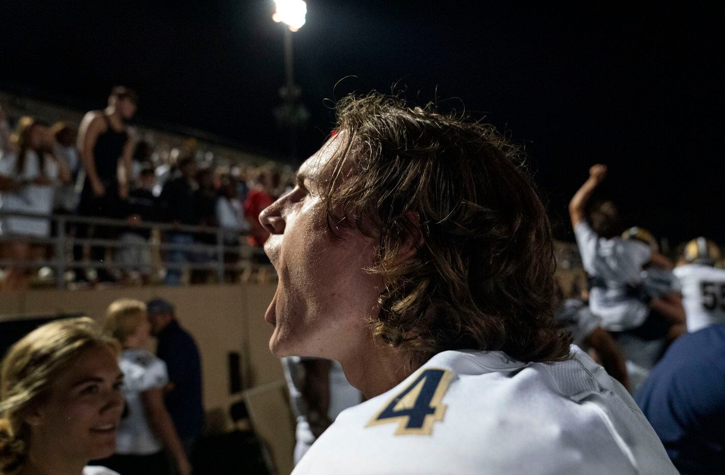 Little Elm senior quarterback John Mateer (4) celebrates with fans after his team’s 35-31 win over Plano West in a high school football game on Friday, Sept. 10, 2021 at John Clark Stadium in Plano, Texas.  (Jeffrey McWhorter/Special Contributor)