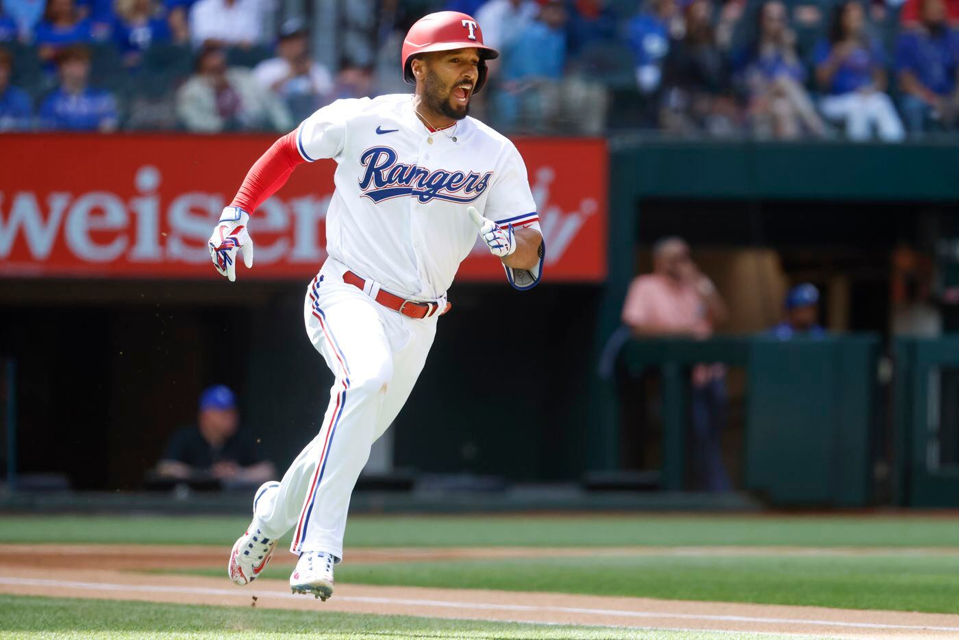 Texas Rangers second baseman Marcus Semien (2) runs after a homers on a line drive during...