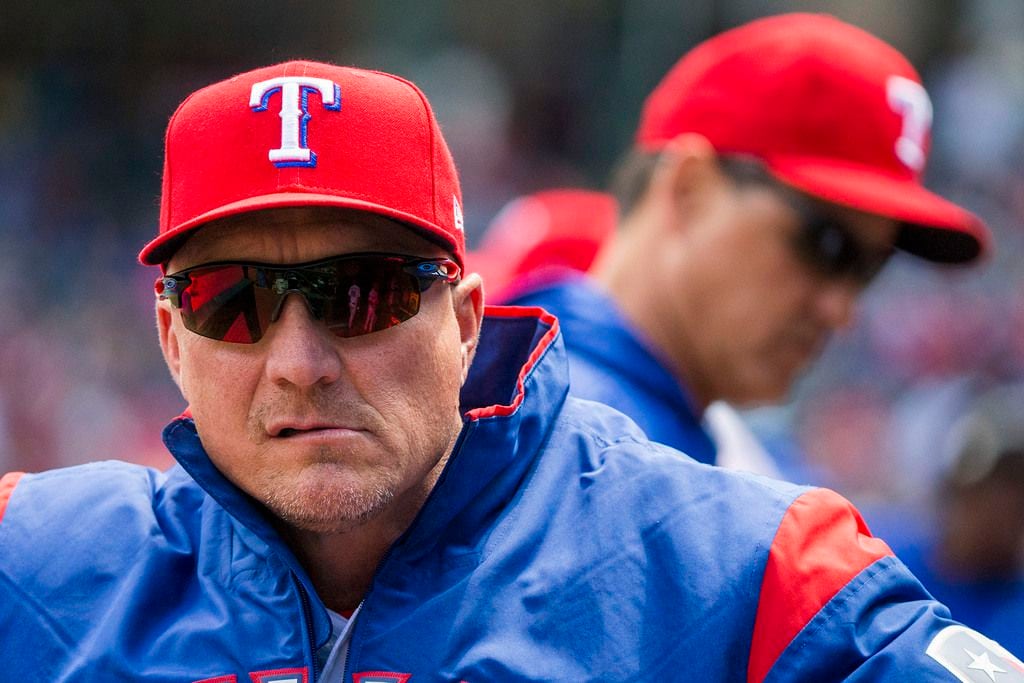 Texas Rangers manager Jeff Banister looks out from the dugout before a game against the...