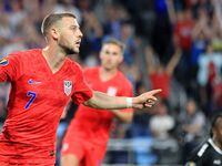 United States' Paul Arriola (7) celebrates after scoring a goal against Guyana goalie Akel Clarke, lower right, during the first half of a CONCACAF Gold Cup soccer match Tuesday, June 18, 2019, in St. Paul, Minn.