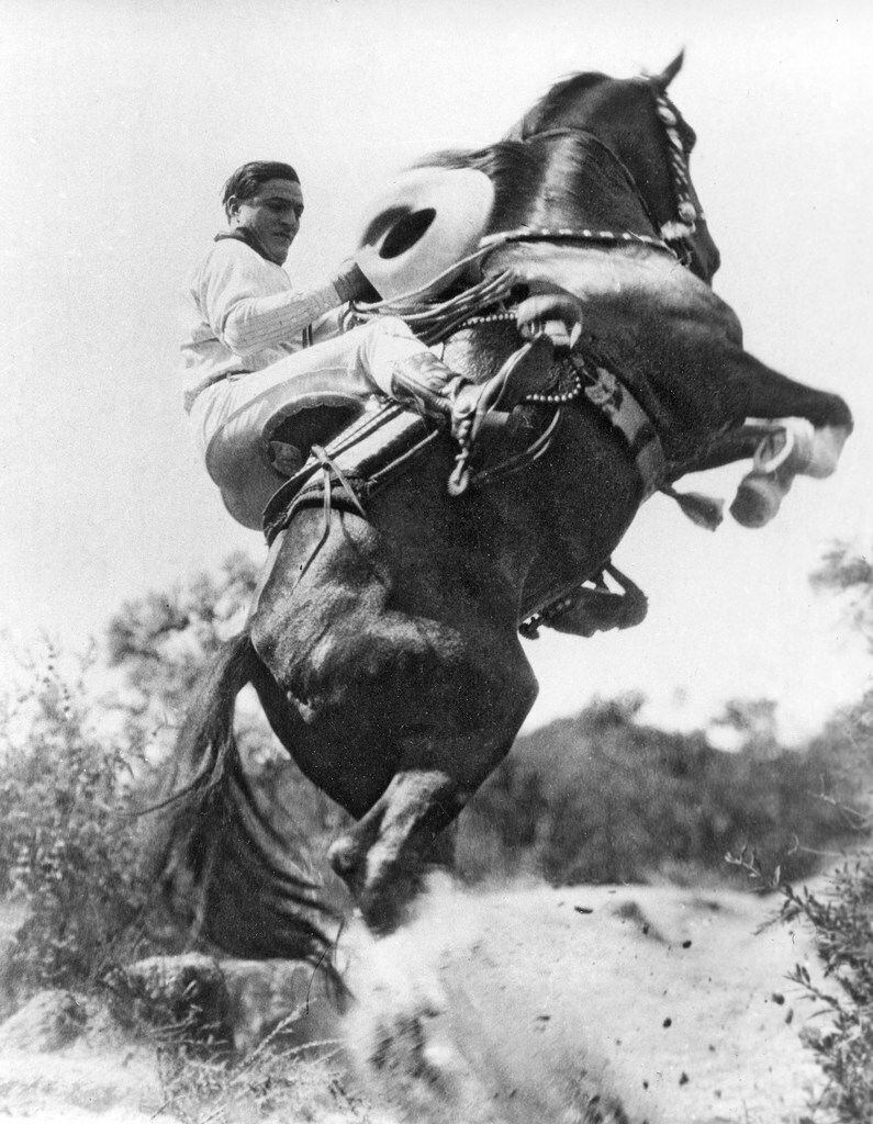 Hollywood western film duo, actor Tom Mix and his horse Tony, perform a stunt on May 1, 1923. 