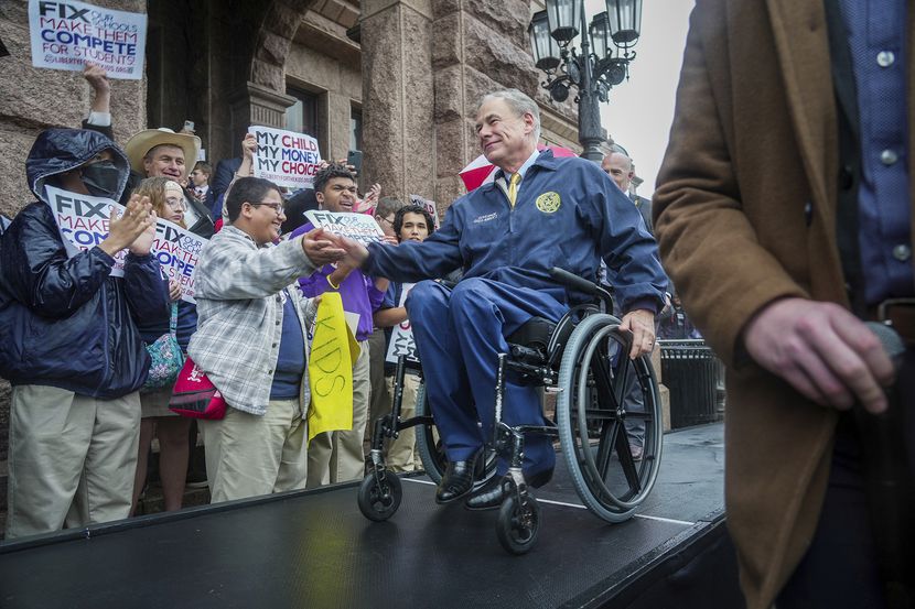 Gov. Greg Abbott makes his way to center stage to speak on the north steps of the State...