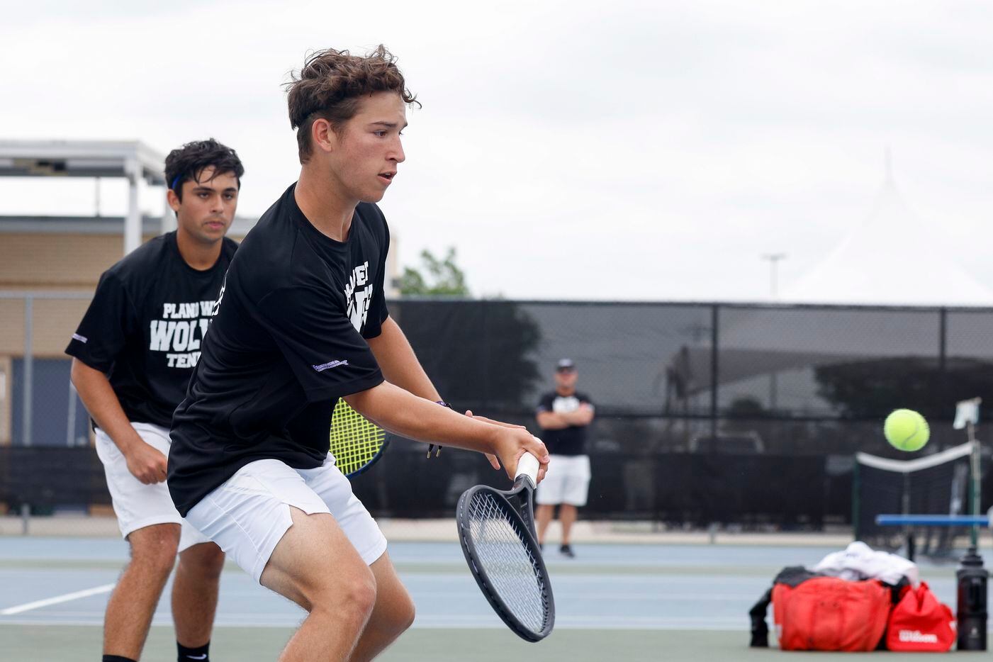 Plano West’s Ethan Scribner plays a volley alongside Kishan Kersten during the 6A boys...