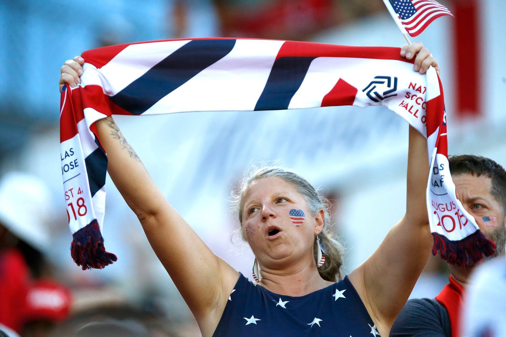 An FC Dallas fan celebrates her team and her country during the first half as FC Dallas...