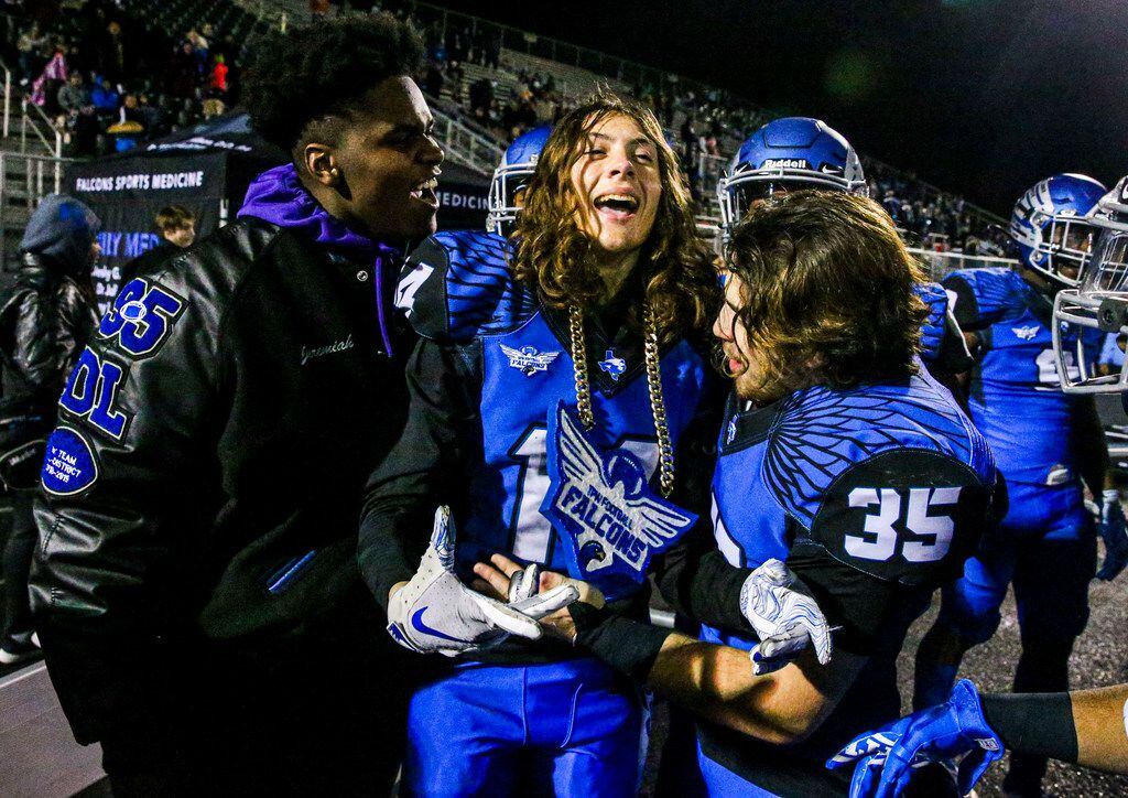 North Forney defensive back Jacob Donaldson (14) celebrates with his team after intercepting...