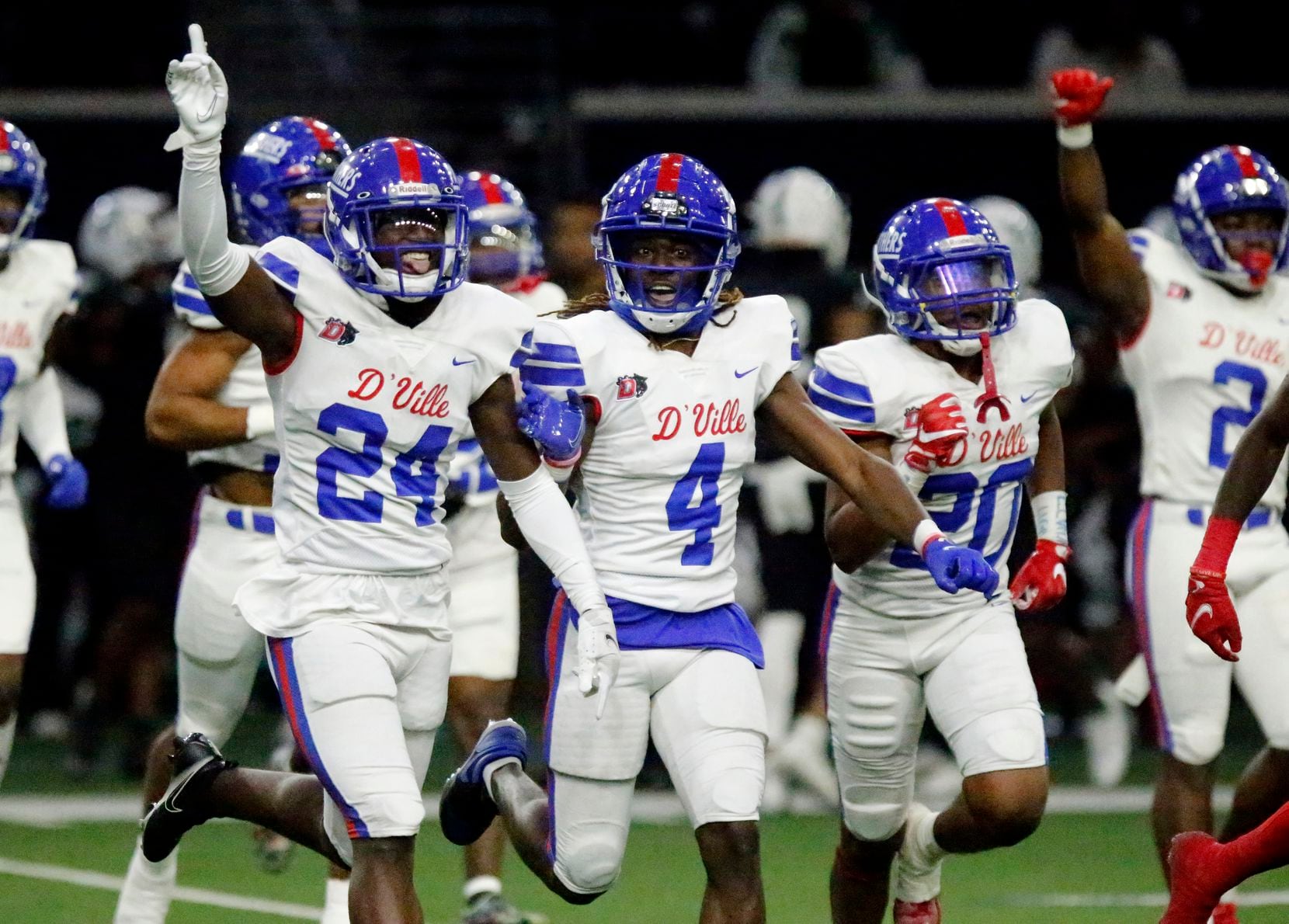 Duncanville High School defensive back Ka’davion Dotson-walker (24) celebrates his interception with the defense during the first half as Duncanville High School played Spring High School in a Class 6A Division I Region II semifinal football game at The Ford Center in Frisco on Saturday, November 27, 2021. (Stewart F. House/Special Contributor)