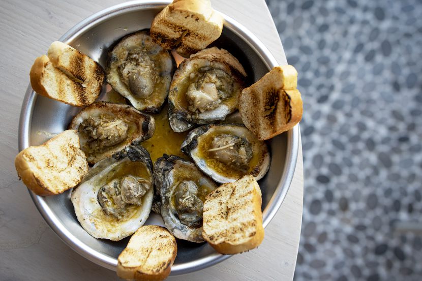 Chargrilled oysters are on the menu at Krio restaurant in the Bishop Arts District.