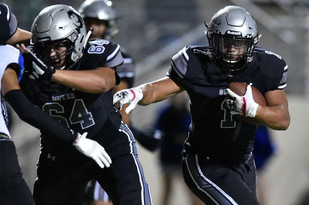 Guyer running back Kaedric Cobbs (1) rushes the ball and scores a touchdown against the...