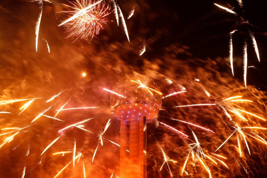 Fireworks fly from Reunion Tower during the New Year's Eve event in Dallas on Dec. 31, 2016. 