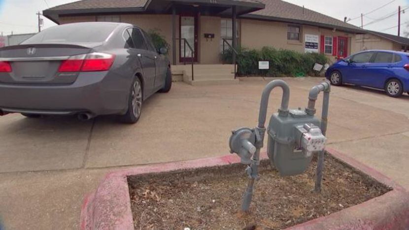 This natural gas meter stands right by an office parking lot in Plano, a few feet from the...