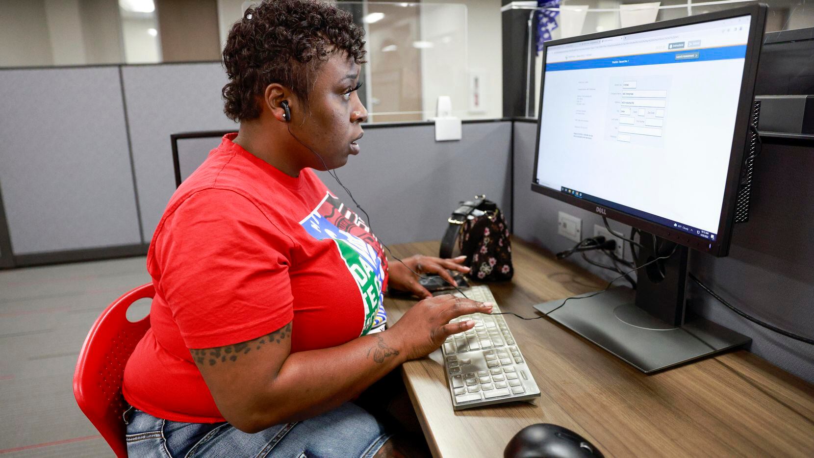Mahogany Kennedy, 40, fills out a practice job application at the Redbird Workforce Center...