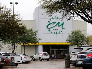 The Central Market parking lot off of Lovers Lane in Dallas on Saturday. Shopping for staples has increased at grocery stores due to the coronavirus.