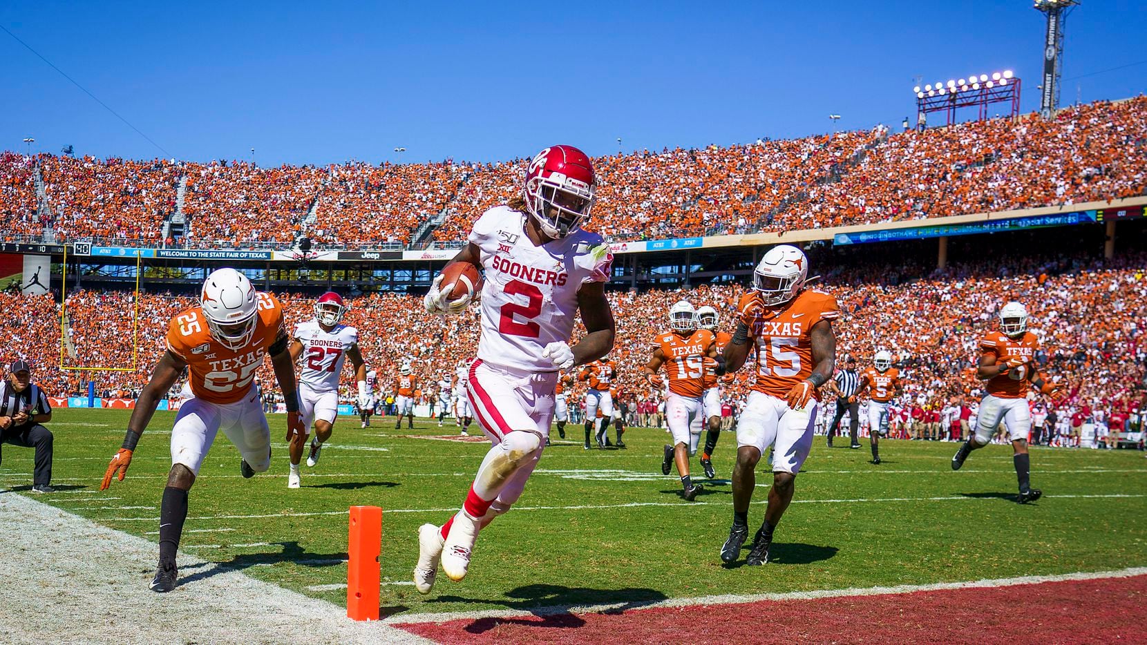 Oklahoma wide receiver CeeDee Lamb (2) scores on a 51-yard pass play past Texas defensives...