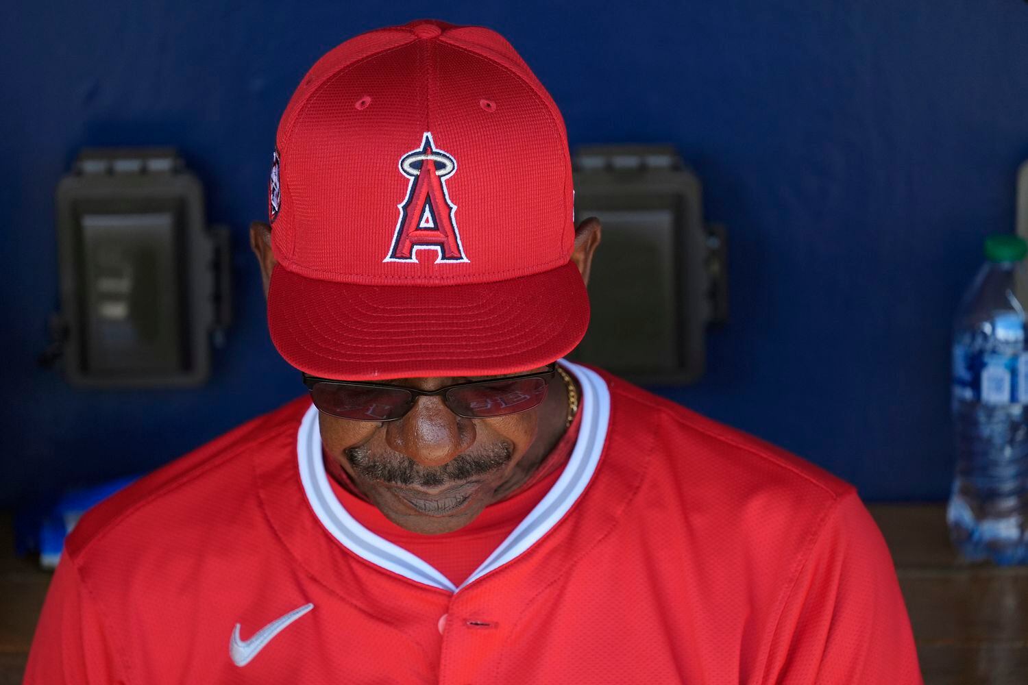 Los Angeles Angels manager Ron Washington pauses in the dugout prior to a spring training...