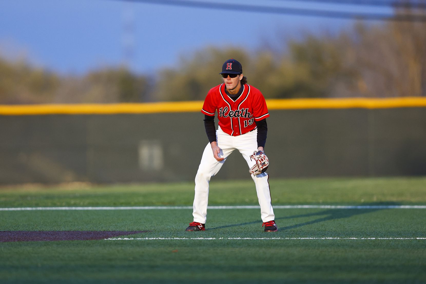 Rockwall-Heath third baseman Jonny Lowe stands ready for a hit during a district 10-6A high...