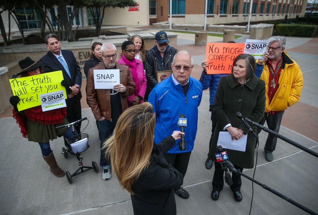 Tim Lennon (left in blue coat), a survivor of clergy sex abuse and president of the Survivors Network of those Abused by Priests (SNAP) and Lisa Kendzior (right in green coat), leader of the Dallas-Fort Worth chapter of SNAP, spoke Jan. 31 during a news conference where survivors of clergy sex abuse and advocates from SNAP responded to the list of names of accused clerics released by the Archdiocese of Dallas.