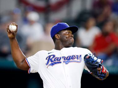 Texas Rangers relief pitcher Jharel Cotton (45) throws against the Oakland Athletics during...