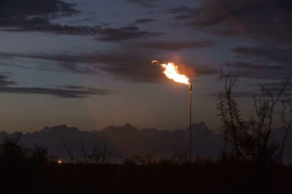 Flare from an oil rig in Balmorhea, Texas. Environmentalists are calling on the University...