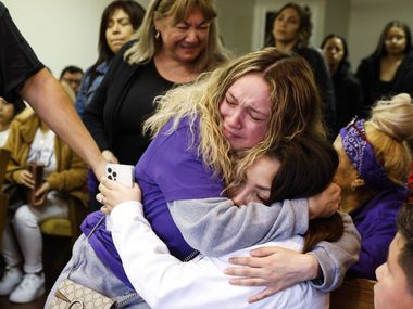 Cathleen Rodriguez, left, cousin of late Gabriel Zamora, 14, embraces Zamora’s mother Martha...