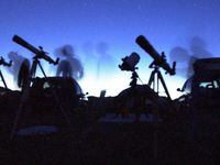 Amateur astronomers peer into their telescopes in 2021. Five planets — Mercury, Jupiter,...