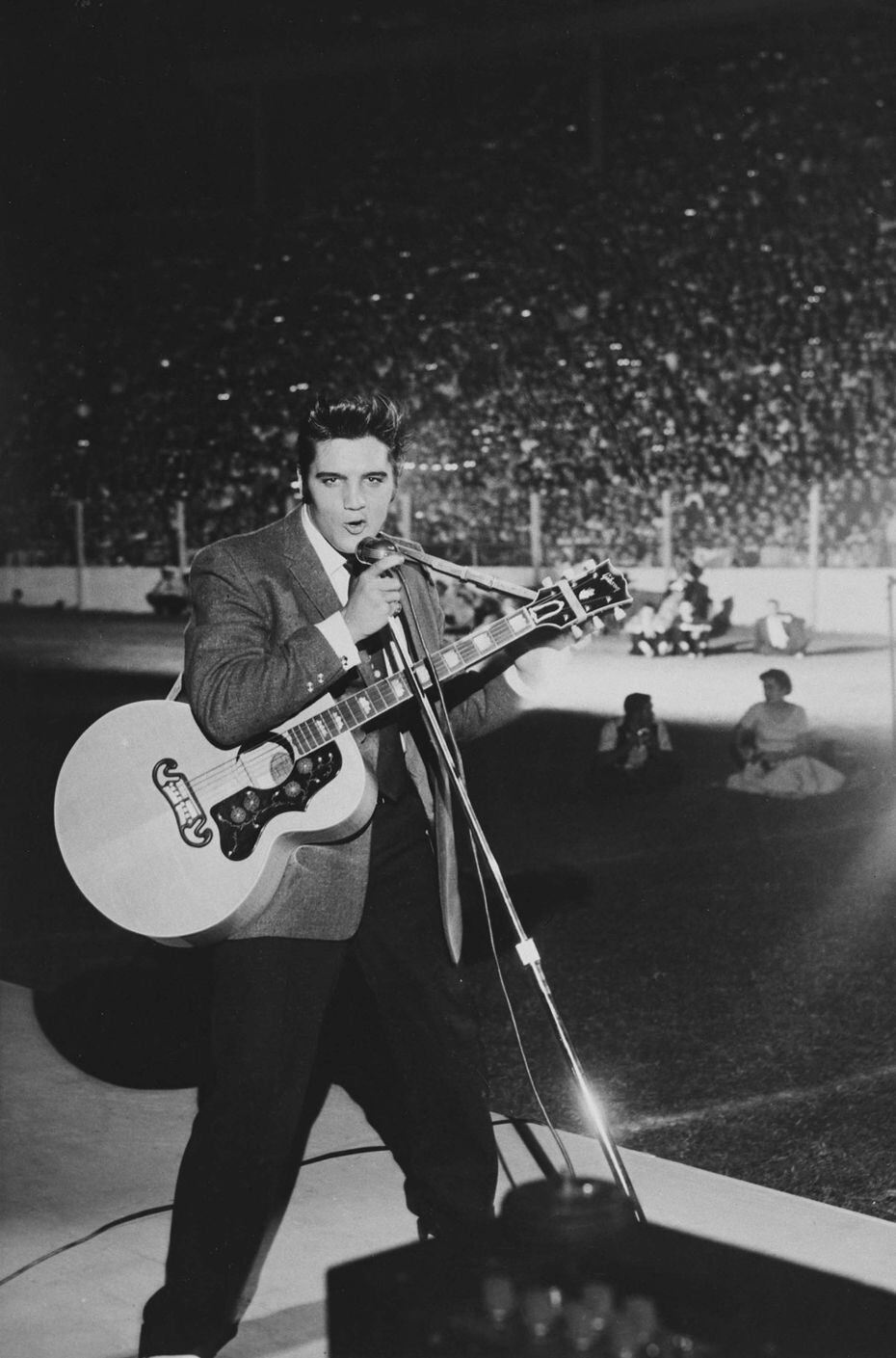 Elvis Presley performing at the Cotton Bowl during the State Fair of Texas in 1956. 