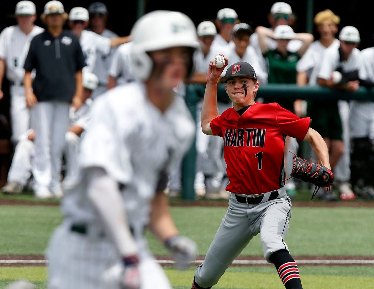 Martin pitcher Luke Spencer (1) throws out Prosper outfielder Jacob Nelson (19) in the fifth...
